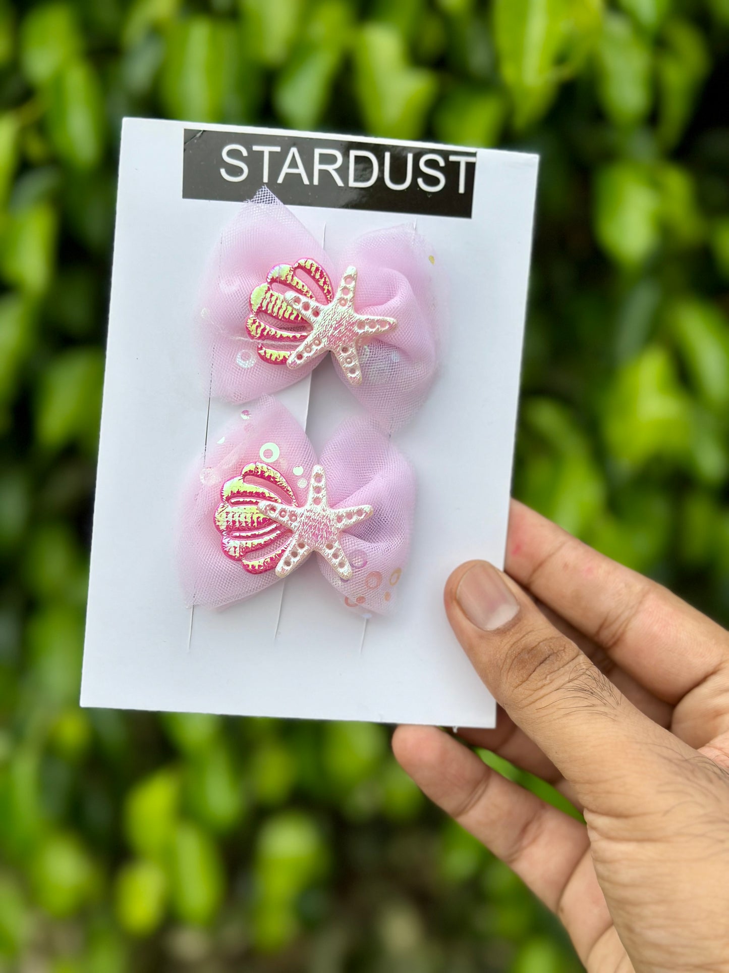 Organza bow pairs with starfish and seashell detailing