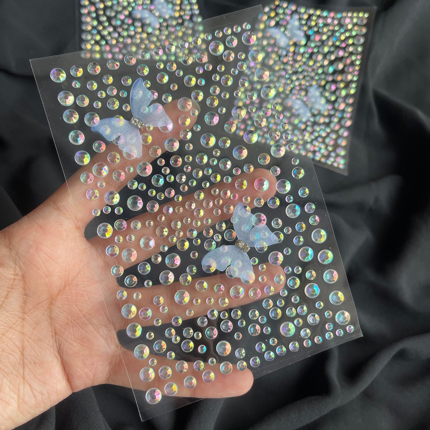 Stickon Irridiscent Rhinestones in various sizes with 2 stickon butterflies
