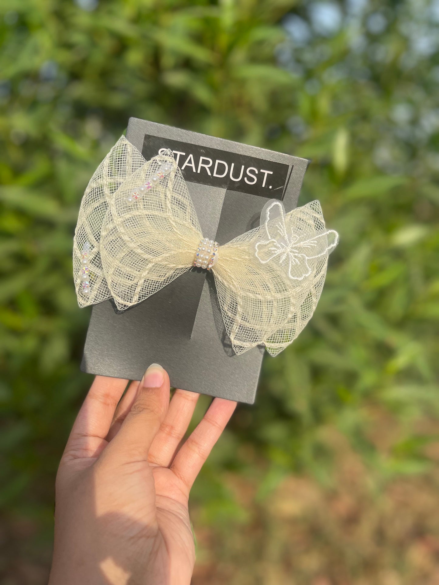 3D net bow with butterfly detailing