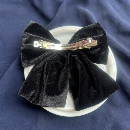 Black velvet hanging bow