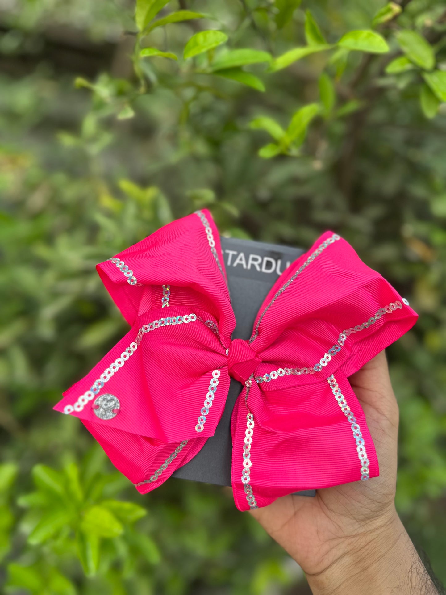 Hotpink jojo bow with silver sequin lining