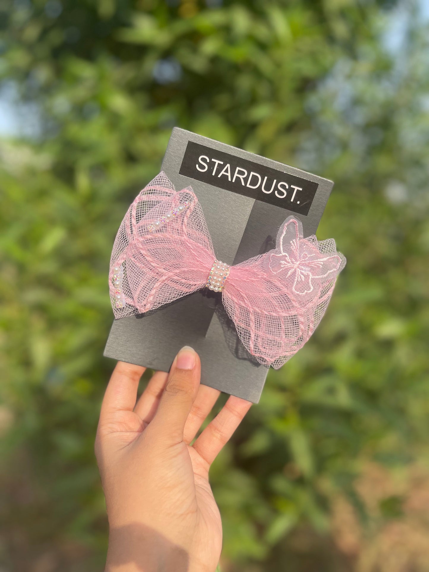 3D net bow with butterfly detailing